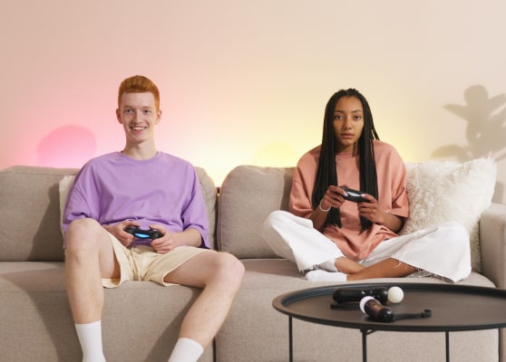Students playing PlayStation while consultants handle their applications.