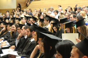 Students Sitting in Hall for Graduation Ceremony